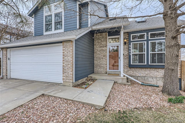 view of front facade featuring brick siding, roof with shingles, an attached garage, and concrete driveway