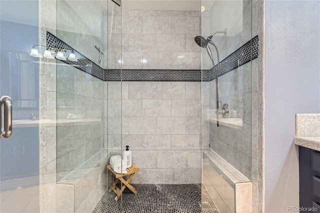 full bathroom with vanity and walk in shower