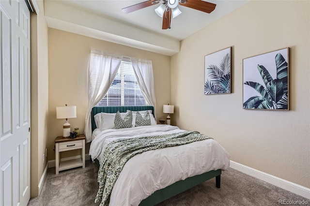 carpeted bedroom featuring a ceiling fan and baseboards