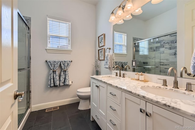 bathroom with a shower stall, a sink, visible vents, and a healthy amount of sunlight