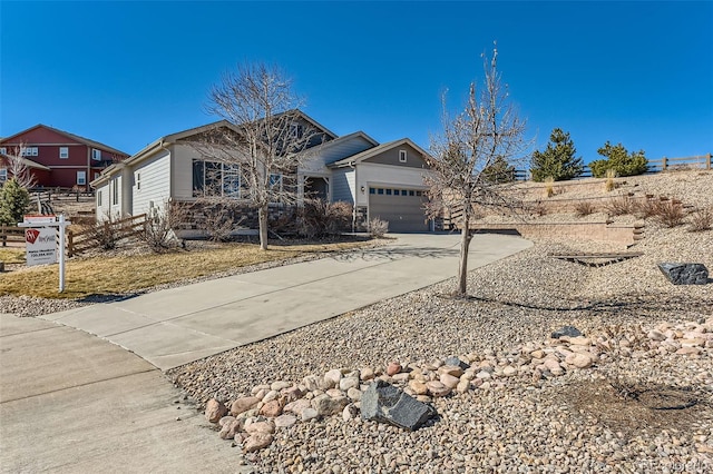 view of front of property featuring a garage and concrete driveway