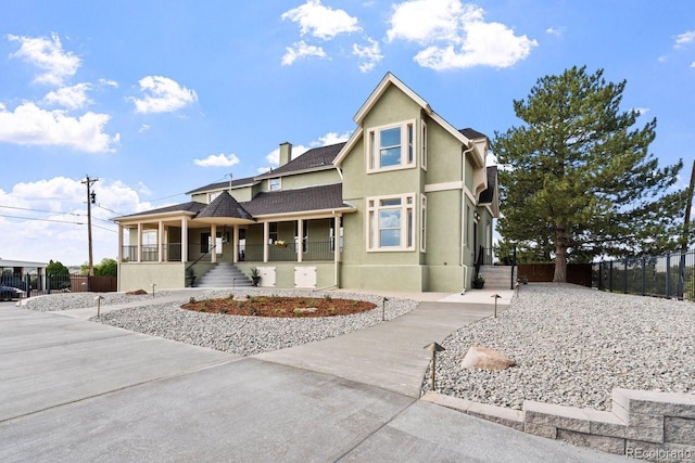 view of front of property featuring covered porch