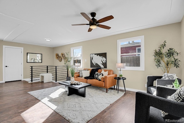 living room featuring dark hardwood / wood-style floors and ceiling fan