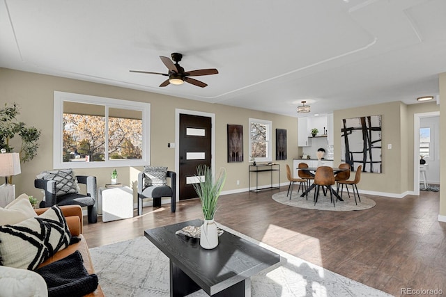 living room featuring dark hardwood / wood-style floors and ceiling fan