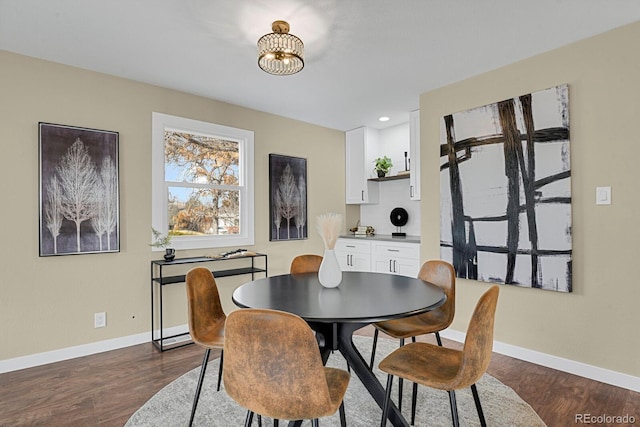 dining room with dark hardwood / wood-style floors