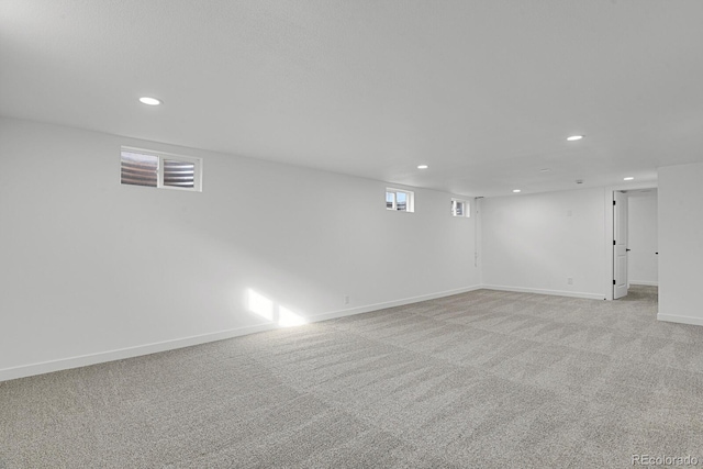 basement with light colored carpet