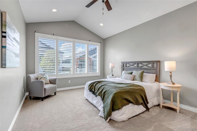 bedroom with baseboards, lofted ceiling, and carpet