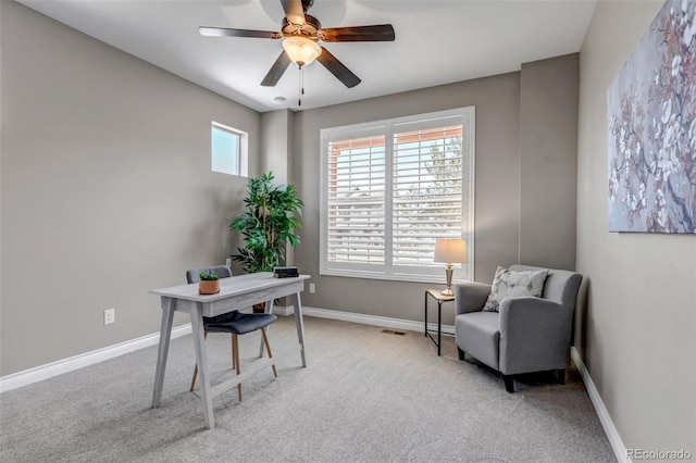 home office with visible vents, carpet flooring, baseboards, and ceiling fan