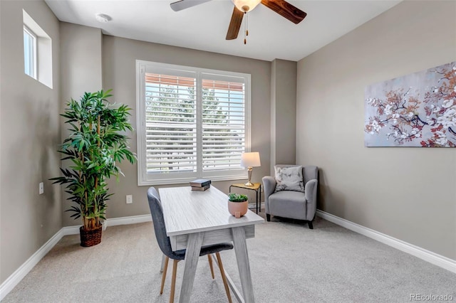 office area with a ceiling fan, baseboards, light carpet, and a healthy amount of sunlight