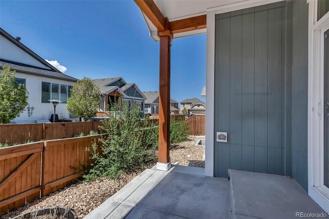 view of patio with a fenced backyard and a residential view
