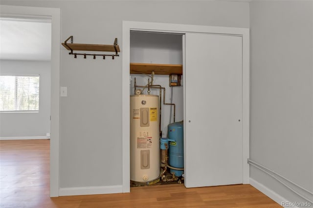 utility room featuring electric water heater