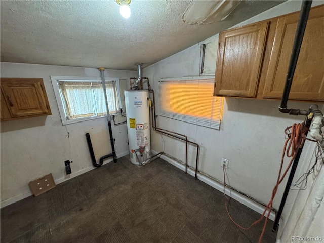 basement with water heater and a textured ceiling