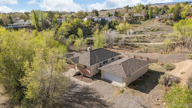 birds eye view of property with a residential view