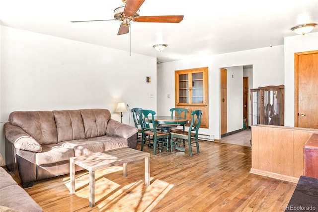 living room with light wood-style floors and ceiling fan
