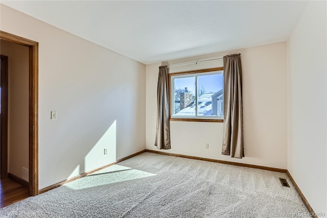 unfurnished room with carpet flooring