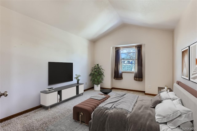 living room with lofted ceiling, carpet, and baseboards