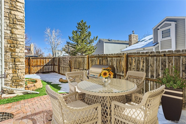 view of patio / terrace with outdoor dining area and a fenced backyard