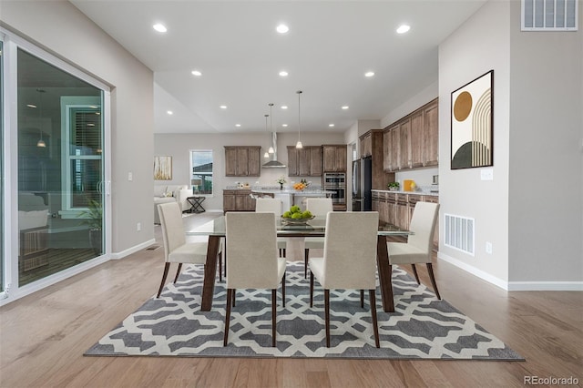 12953 Bridge View Ln, Parker, CO 80134 - dining space featuring light wood-type flooring and recessed lighting