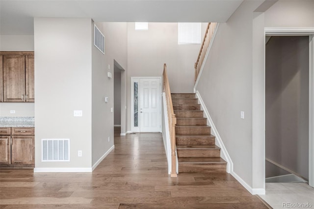 12953 Bridge View Ln, Parker, CO 80134 - staircase with wood finished floors and baseboards