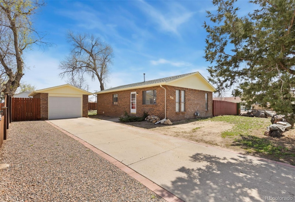 902 Pacific Pl, Fort Lupton, CO 80621 - ranch-style house with brick siding, driveway, and fence