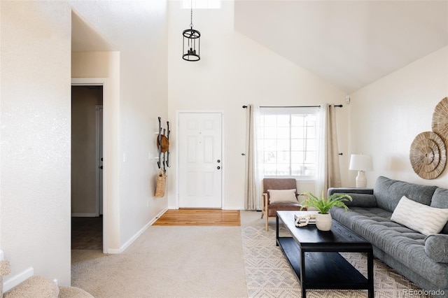 living room featuring light carpet and high vaulted ceiling