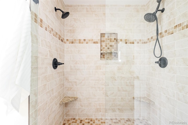 bathroom with tiled shower