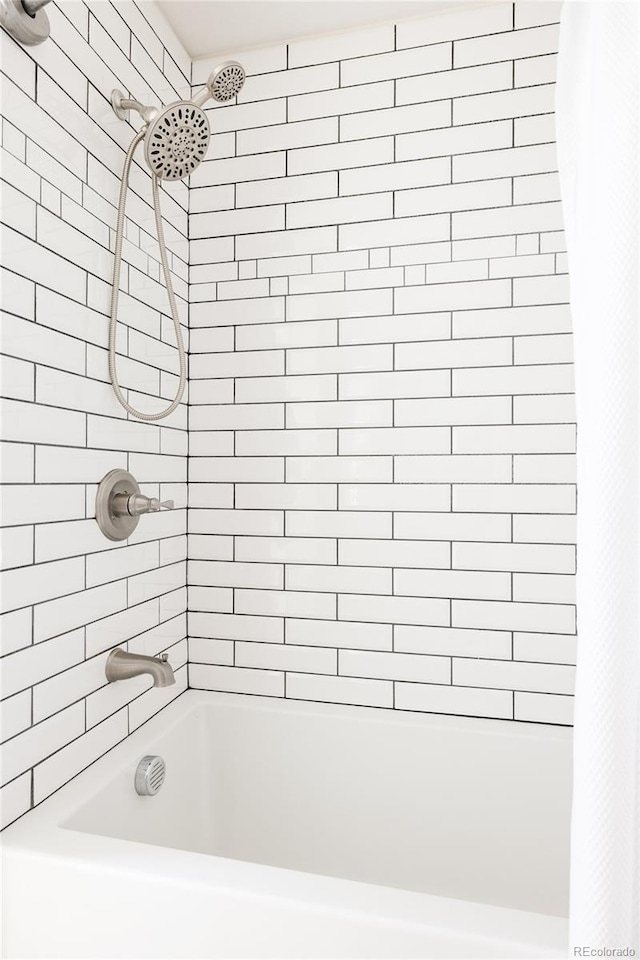 bathroom featuring shower / bath combo with shower curtain