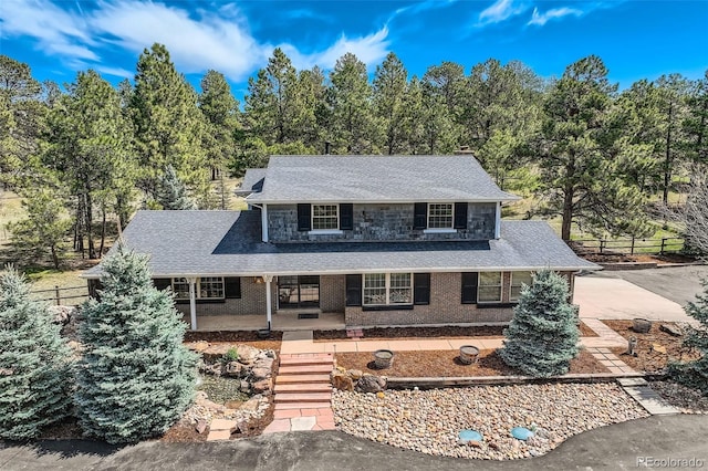 12454 Antelope Trl, Parker, CO 80138 - view of front facade featuring a porch and roof with shingles