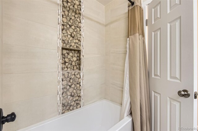 12454 Antelope Trl, Parker, CO 80138 - bathroom featuring shower / bath combo with shower curtain