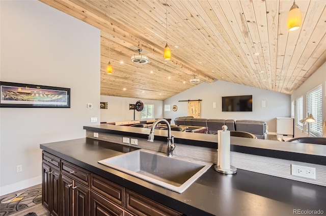 12454 Antelope Trl, Parker, CO 80138 - kitchen with dark countertops, wood ceiling, open floor plan, and dark brown cabinetry