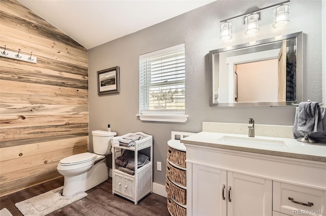 12454 Antelope Trl, Parker, CO 80138 - bathroom featuring wood walls, lofted ceiling, wood finished floors, and vanity