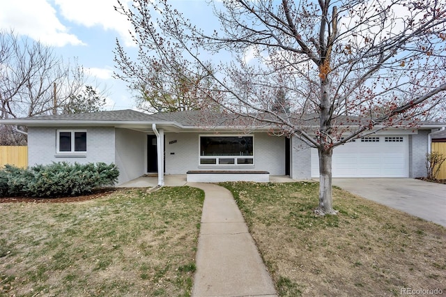 ranch-style house with fence, a front yard, brick siding, concrete driveway, and an attached garage