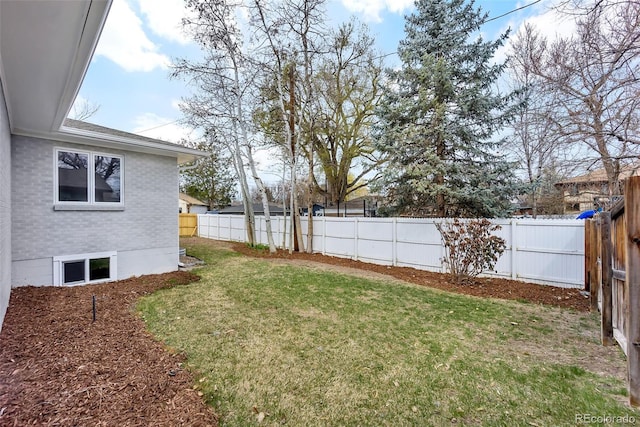 view of yard with a fenced backyard