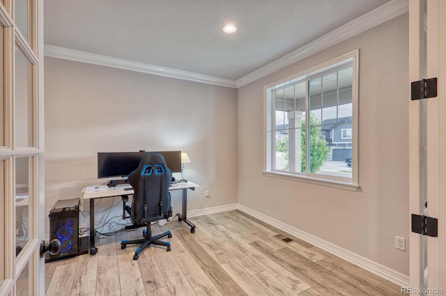 office space with light hardwood / wood-style flooring and ornamental molding