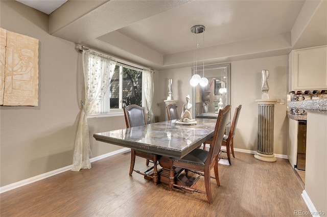 dining space featuring hardwood / wood-style floors