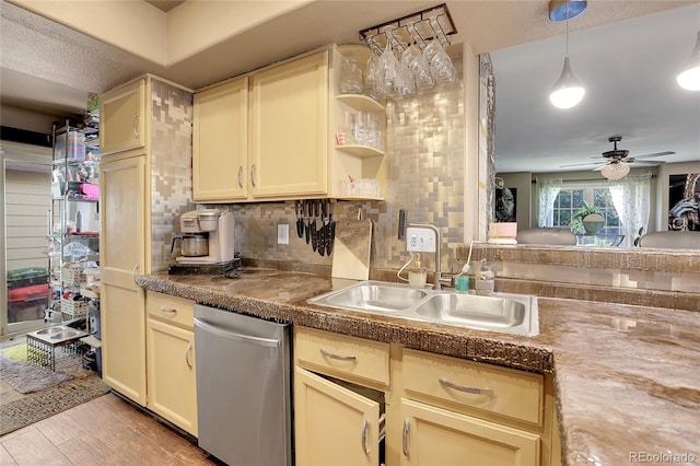 kitchen featuring cream cabinetry, sink, and ceiling fan