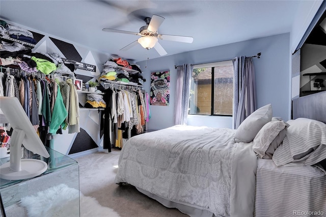 bedroom with light carpet and ceiling fan