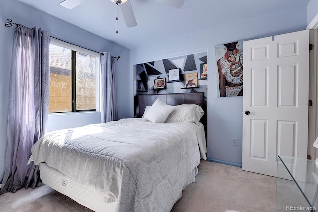 bedroom with light carpet and ceiling fan