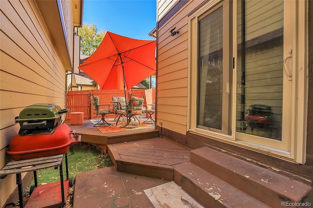 wooden deck with area for grilling