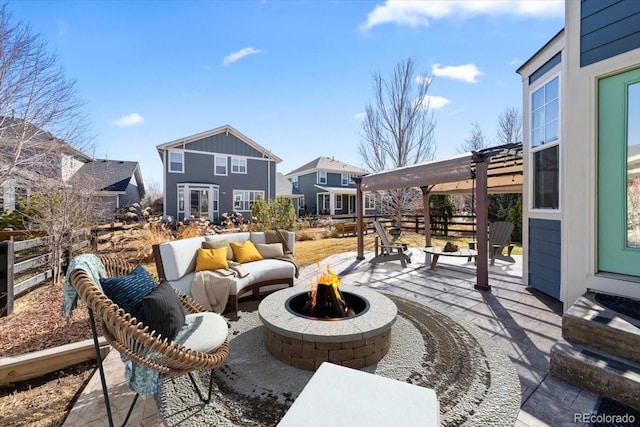 view of patio featuring a fire pit, fence, and a pergola