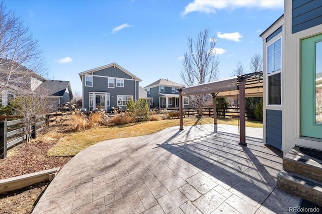 view of patio featuring fence and a pergola