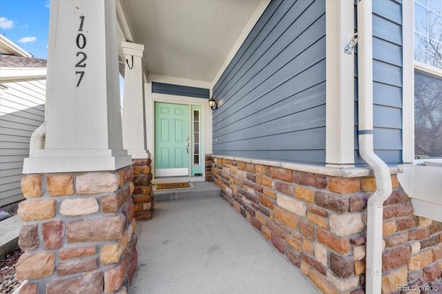 property entrance with stone siding