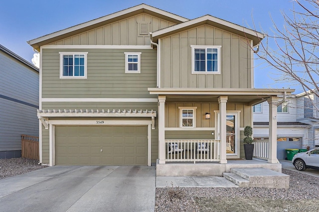 view of front of home with a garage and a porch