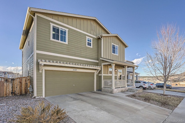 view of front of property featuring a porch and a garage