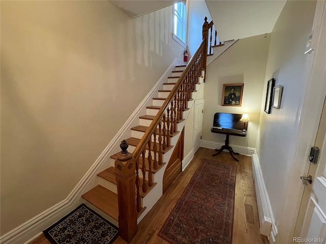2335 Stout St, Denver, CO 80205 - staircase with wood finished floors, baseboards, and baseboard heating