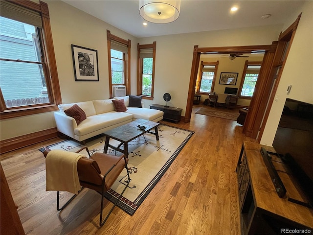 2335 Stout St, Denver, CO 80205 - living room featuring light wood-style flooring, baseboards, recessed lighting, a ceiling fan, and cooling unit