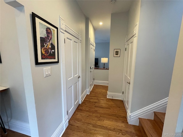 2335 Stout St, Denver, CO 80205 - hallway featuring dark wood finished floors, recessed lighting, and baseboards