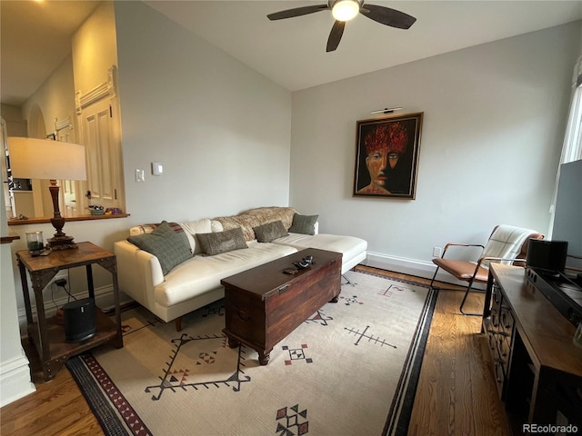 2335 Stout St, Denver, CO 80205 - living area featuring a ceiling fan, wood finished floors, and baseboards