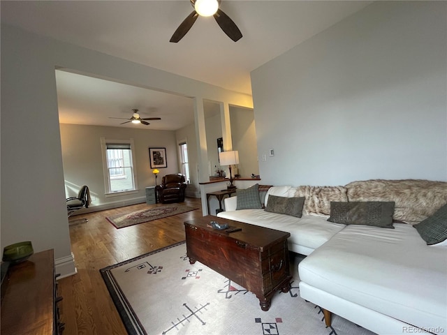 2335 Stout St, Denver, CO 80205 - living area with ceiling fan and wood finished floors