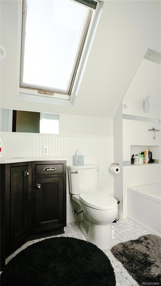 2335 Stout St, Denver, CO 80205 - full bath featuring toilet and a skylight
